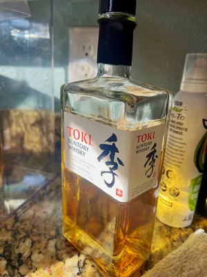 Sunlight hitting a bottle of Toki Japanese whiskey in the kitchen
