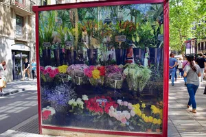 Image of flower bouquets on the side of a sidewalk stand