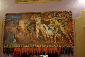 Dali painting of nudes adorned with tassles and plastic berries